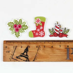Close-up view of mixed Christmas wooden buttons with festive holiday designs for DIY crafts.