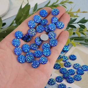 Blue sparkling resin flatback rhinestones for DIY crafts, scrapbooking, and clothing accessories.
