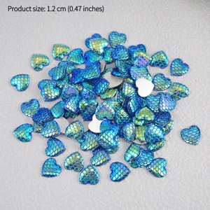 Detail view of gradient mermaid scale heart flatback acrylic cabochons for DIY crafts.