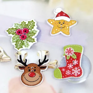Detailed shot of assorted Christmas wooden buttons, including reindeer, stocking, and holly designs.