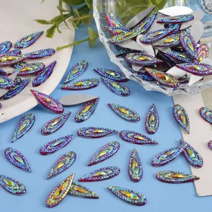 Detail shot of iridescent marquise flatback rhinestones for DIY crafts and nail art.