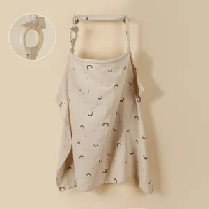 Cotton nursing cover detail showing soft gauze fabric, moon print and wooden ring buckle.