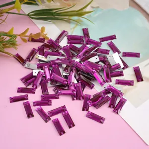 Close-up detail view of purple rectangular flatback rhinestones for craft garment decoration.