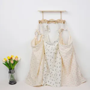 Cotton nursing cover double gauze stroller blanket with floral prints and bow details.
