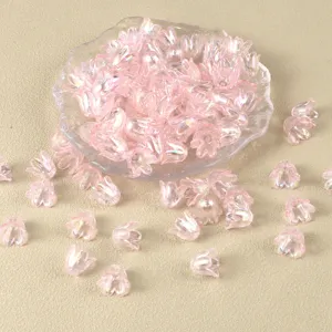 Close-up details of pink AB coated bellflower beads for DIY handmade jewelry crafts.