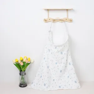 Detail view of a breathable cotton nursing cover featuring cute blue star and planet prints.