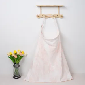 Soft cotton nursing cover detail, featuring double gauze and pink print for comfortable feeding.