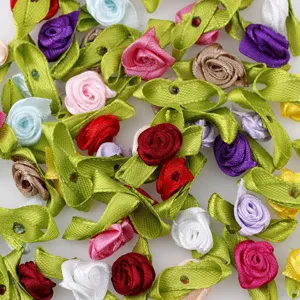 Handmade satin ribbon roses with green leaves, colorful mini fabric flowers for apparel craft decor.