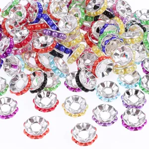 Closeup of colorful round wheel spacer beads with pearl details, ideal for DIY jewelry making.