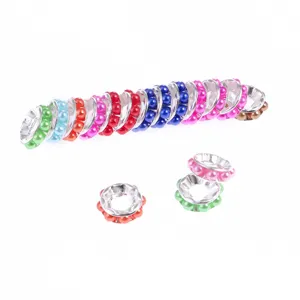 Close-up of colorful ABS plastic wheel spacer beads for DIY handmade bracelets and necklaces.