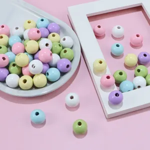Perles en bois pastel colorées rondes en vrac pour fabrication de bijoux DIY enfants.