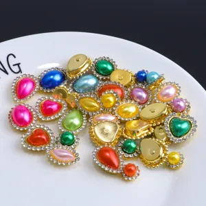 Detailed view of colorful rhinestone buttons, sparkling crystal DIY craft accessories.