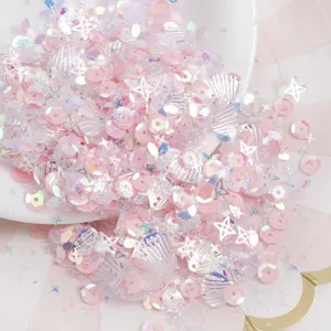 Rosa und schimmernde Nagelkunst-Pailletten, Muschel- und Stern-Glitterflöckchen für DIY-Basteln.