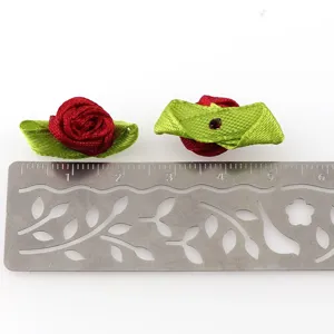 Handmade ribbon rose flowers with green leaves, DIY apparel accessories and craft supplies.