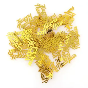 Gold Happy New Year confetti plastic glitter table scatter for holiday party decor.