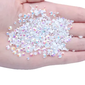 Mixed size white AB resin flatback rhinestones for nail art and DIY crafts decoration.