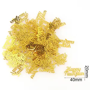 Gold plastic Happy New Year confetti glitter flakes for festive party table decorations.