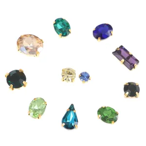 Assorted glass rhinestone claw settings detail shot, featuring multiple shapes and colors.
