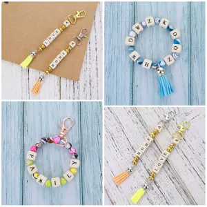 DIY wooden alphabet letter beads keychain bracelet accessories with colorful beads and tassels.