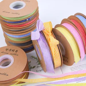 Colorful gingham ribbons detail shot, plaid fabric trim for DIY crafts, gift and flower wrapping.