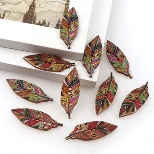 Painted wooden leaf buttons with tribal prints for DIY kids clothing and sewing crafts.