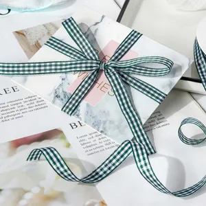 Green and white checkered ribbon detail, perfect for gift wrapping and DIY crafts staging.