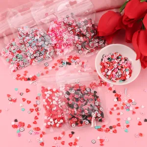 Valentine polymer clay slices for nail art DIY crafts, romantic heart envelope confetti.