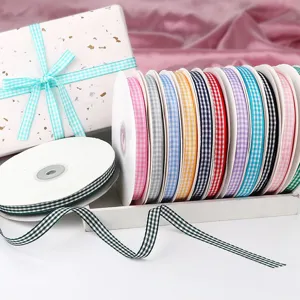 Colorful gingham ribbon rolls for gift wrapping, crafts, and floral DIY decoration.