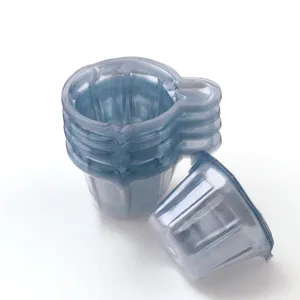 Disposable clear plastic measuring cups for resin DIY craft mixing, detailed view of stack.
