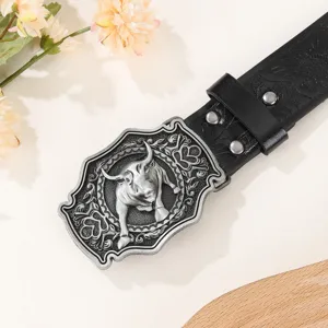 Vintage western style men leather belt with detailed bull metal buckle and carved strap.