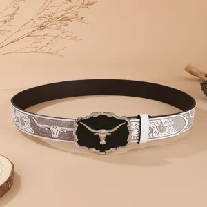 Vintage Western cowboy leather belt featuring alloy longhorn bull head buckle and carved strap.