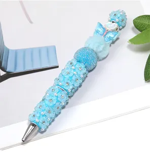Exquisite DIY beaded pen detail view, cute blue macaron color with flower ceramic beads and rhinestones.