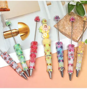 Gradient glass bubble bead DIY beaded pen set with flower rhinestones and cute doll topper for gifts.