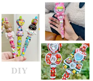 Detailed close-up of Christmas DIY beaded pen showing cute cartoon charms and colorful beads.