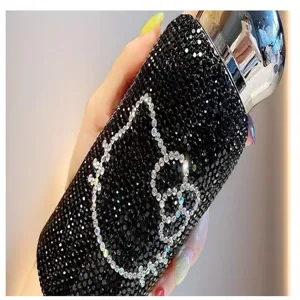 Sparkling rhinestone crystal water bottle with cute cartoon cat character design detail.