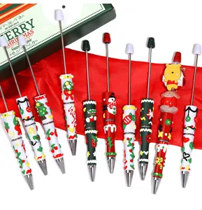 Christmas DIY beaded ballpoint pens set with cute cartoon charms and festive holiday designs.