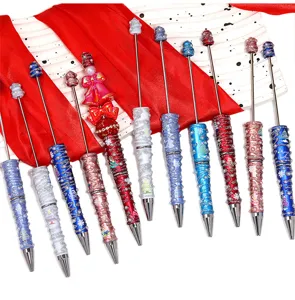 Christmas beaded ballpoint pens with glitter glue pearl and festive painted barrel designs.