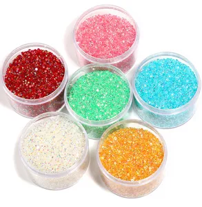 Colorful resin flatback rhinestones in jars, perfect for nail art DIY and crystal painting.