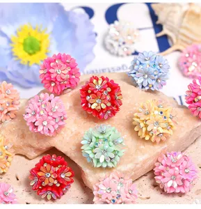 Colorful resin rhinestone flower beads for DIY phone charms and handmade crafts.