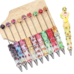 Handmade DIY gradient glass bubble bead beaded pen with cute flower charms for stationery gift.