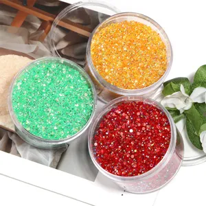 Colorful resin flatback rhinestones in jars for nail art and DIY jewelry crafts, sparkling.
