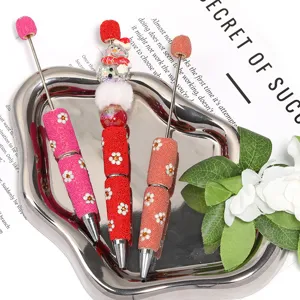 Daisy rhinestone beaded ballpoint pen with flower design and DIY rotating charm for office.