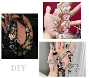 Handmade DIY beaded phone charm detail, sparkling rhinestone heart and star accessories.
