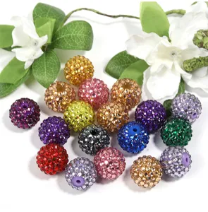 Detail view of colorful rhinestone pave acrylic beads, perfect for DIY jewelry and phone charms.