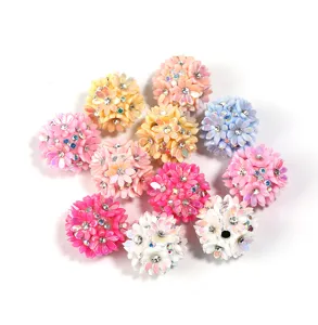 Colorful resin rhinestone flower beads for DIY craft accessories and phone chains.