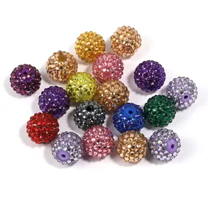 Close-up of colorful 20mm rhinestone acrylic disco balls beads for DIY jewelry making crafts.