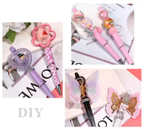 DIY beaded ballpoint pen with sparkling rhinestones and cute charms, perfect for creative stationery.