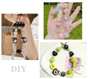 Detailed view of colorful DIY beaded phone charm strap with resin flowers and crystal balls.