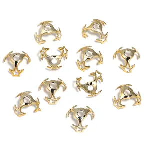 Close-up detail view of shiny gold star-shaped bead caps, perfect for diy jewelry making.