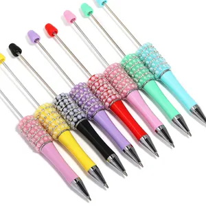 Colorful DIY beadable pens set with pearl rhinestone accents and metal rod for custom crafts.